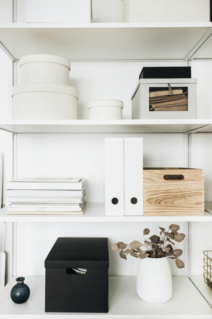 Workspace Organising Services White shelves with tidy storage boxes and folders, creating a clean, focused workspace that supports creativity and productivity.